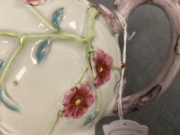 A pair of Chinese famille rose relief-decorated teapots with floral design, Yongzheng